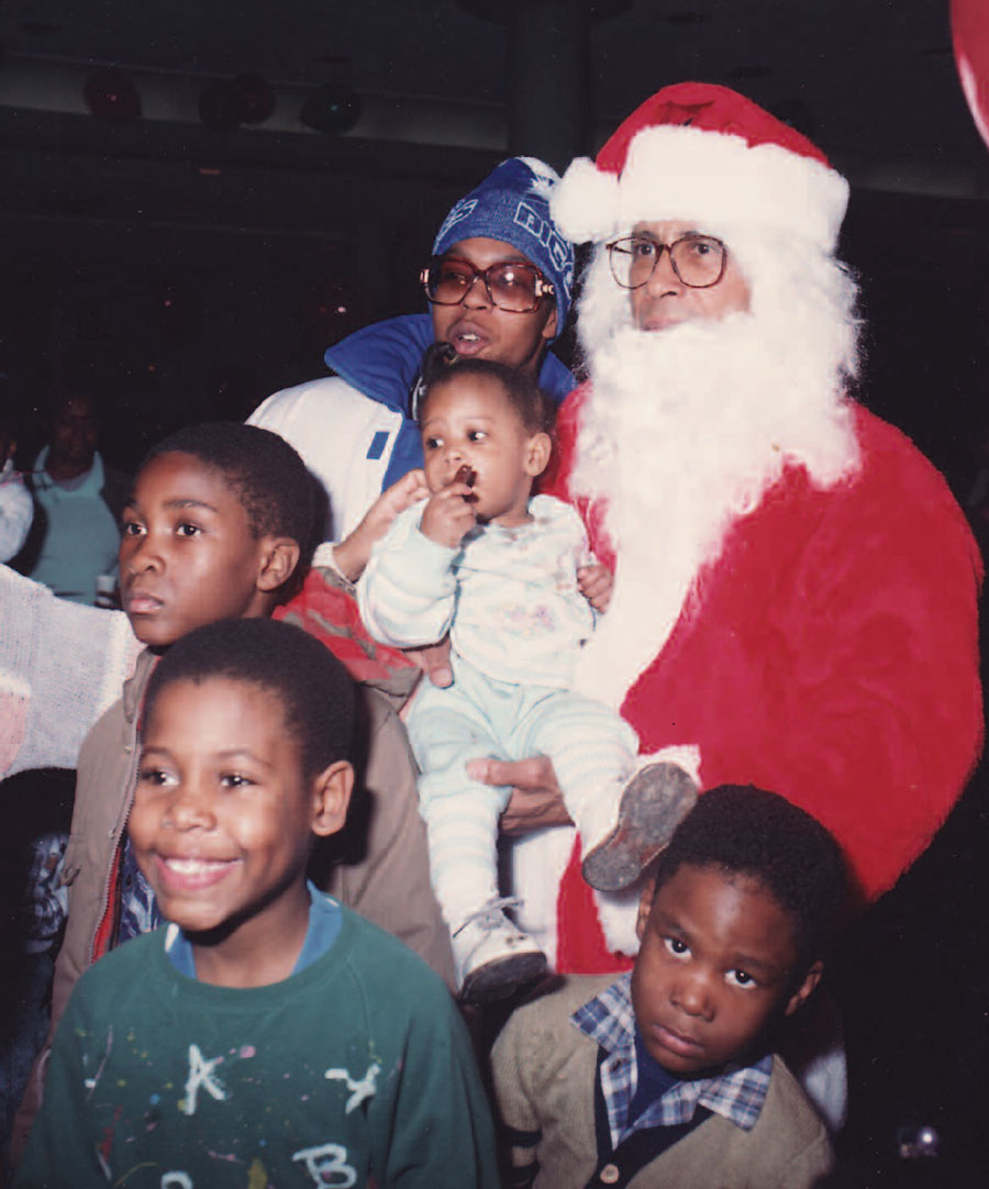 Playing Santa Claus at the Society’s annual holiday party for homeless children.