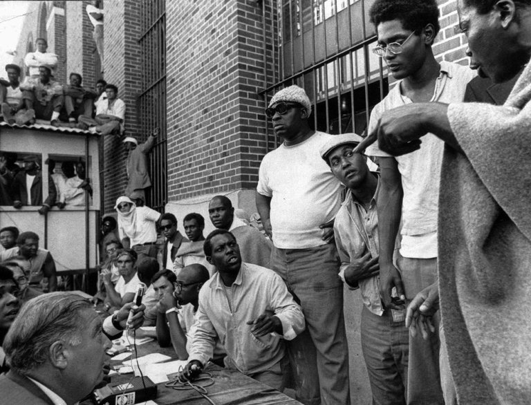 Attica inmates negotiate with state prisons Commissioner Russell Oswald.